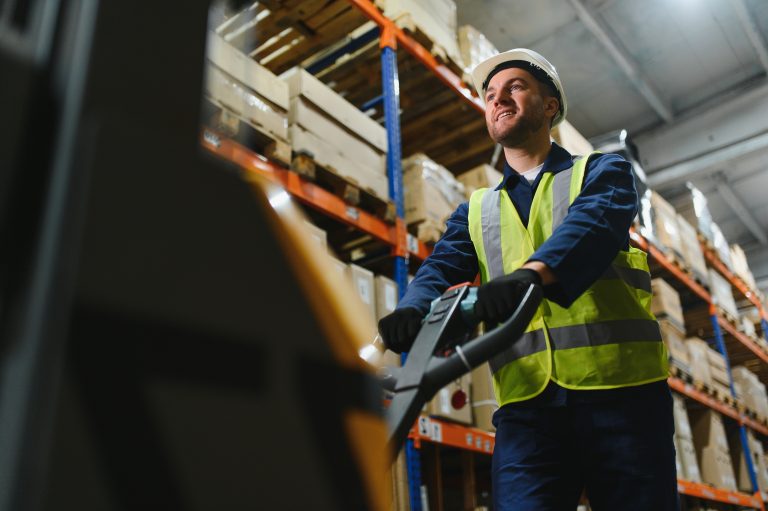 Storehouse manager supervising the lift truck operator.